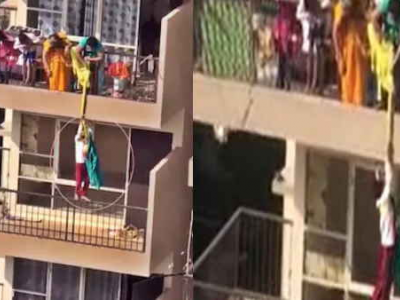 Immagini shock dall’India: donna cala con una corda il figlio dal 10° piano per recuperare un panno