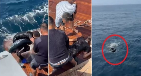 Solo in mezzo al mare aveva addosso solo un salvagente e delle pinne – Il video 